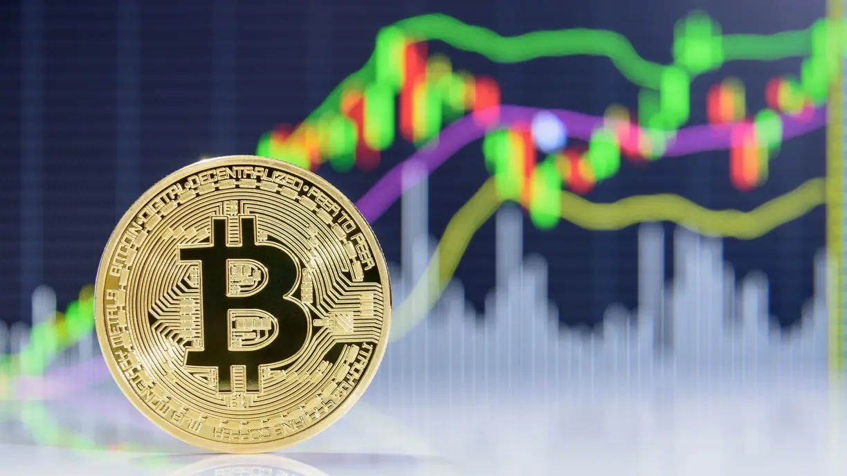 Cryptos climb, stocks hold near record levels as Powell hints at potential rate cut teaser image